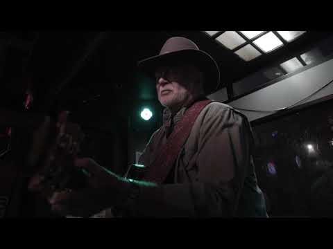 Music video thumbnail featuring a singer in a cowboy hat