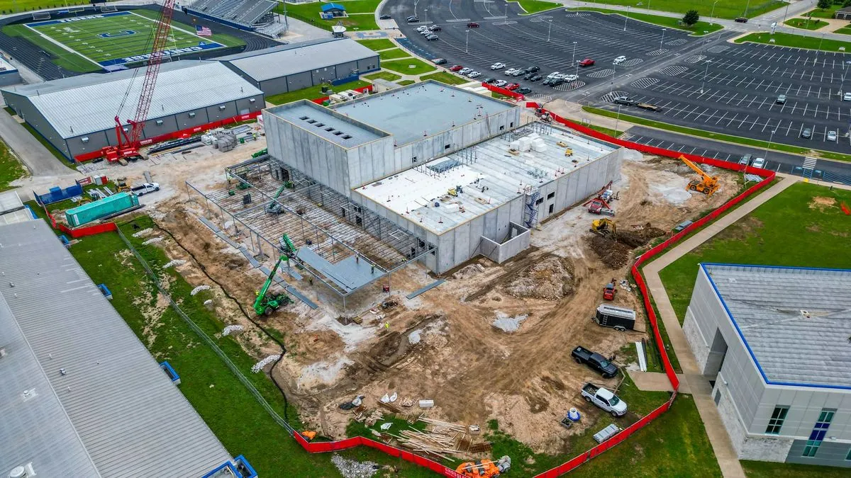 Aerial view of Carthage High School construction site with football field