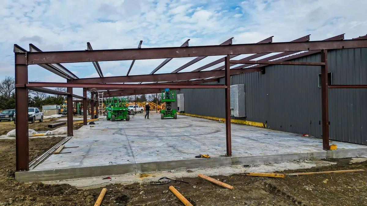 Red steel frame structure under construction
